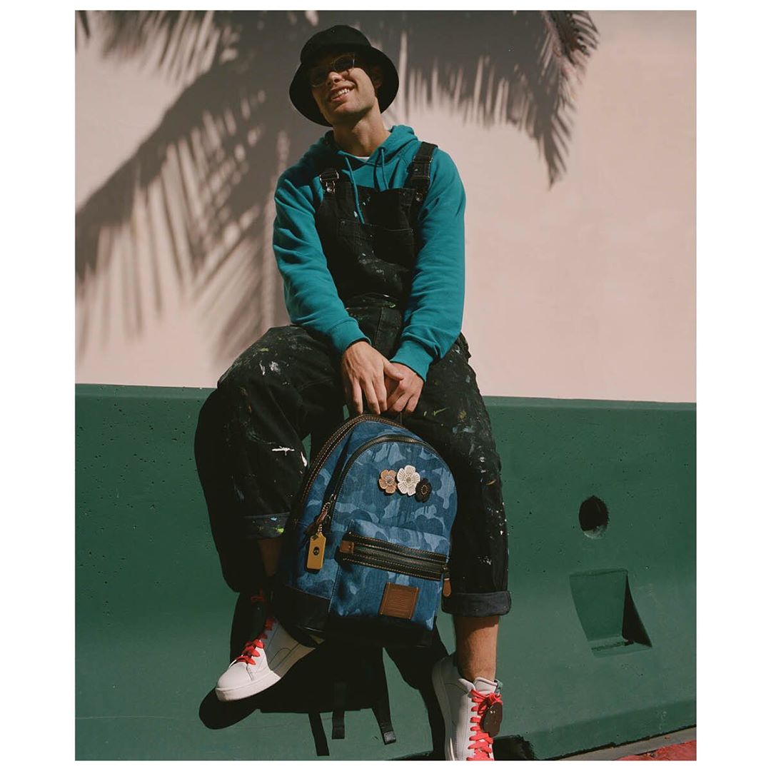 Meet @iam.cooper, an artist living in Los Angeles, who paints his canvases in bright, largescale florals and patterns. Accenting his Academy Backpack in our Wild Beast print with tea roses made sense. “My style is bright and bold and colorful, kind of in-your-face and very happy and positive.” How do you express yourself through your personal style? #CoachNY