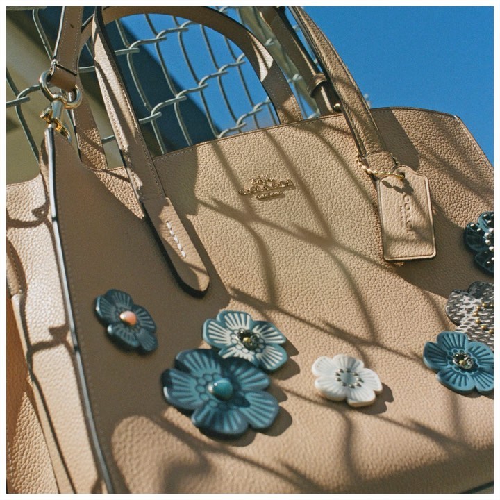 Good vibes only for @durhanewongrieger and her Charlie bag customized with blue Tea Roses. “The Tea Roses are very positive and you can do a lot with them in different colors and varieties.” #CoachCreate #CoachNY