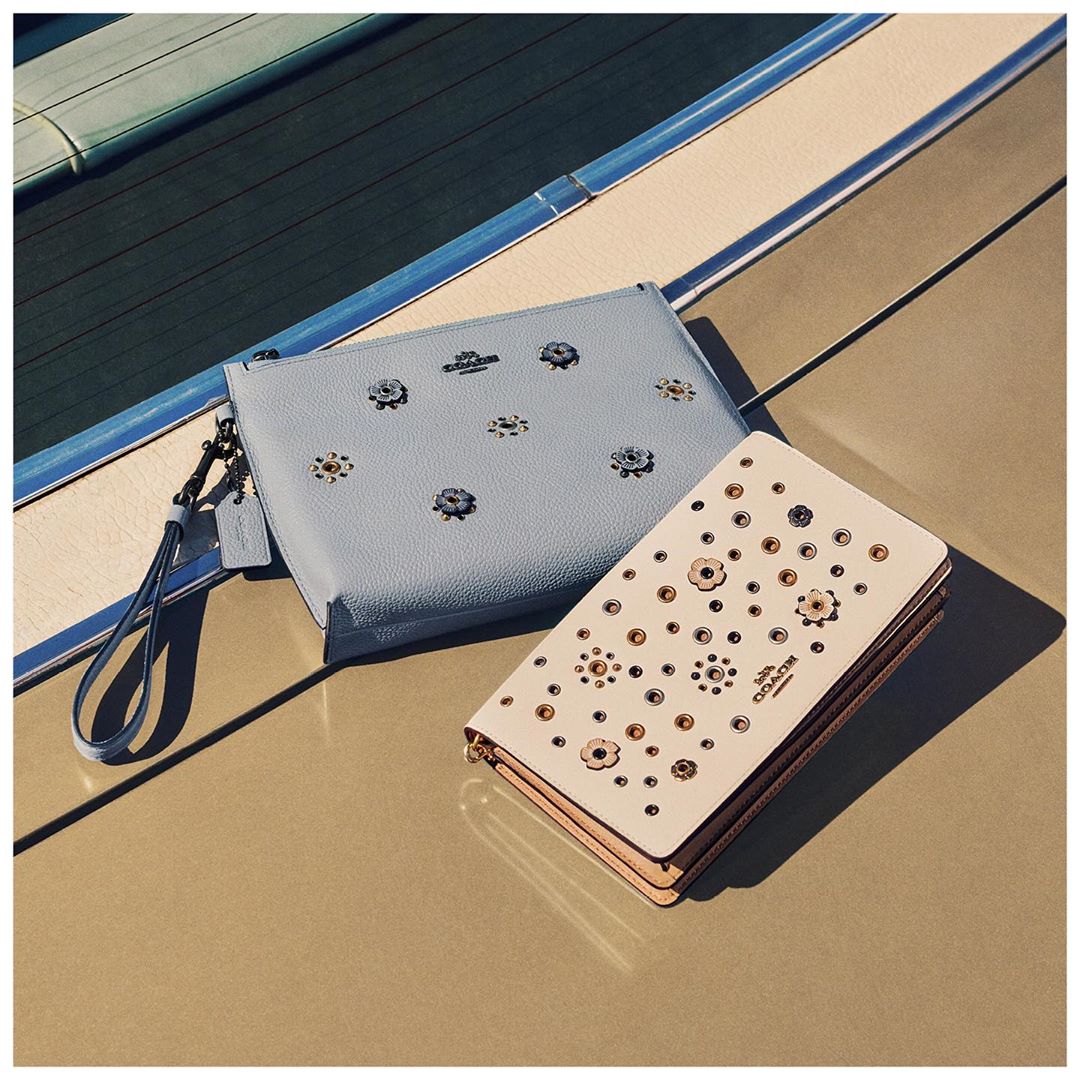 Put the petal to the metal with one of our go-with-anything-always-useful pretty floral rivet pouches. #CoachNY