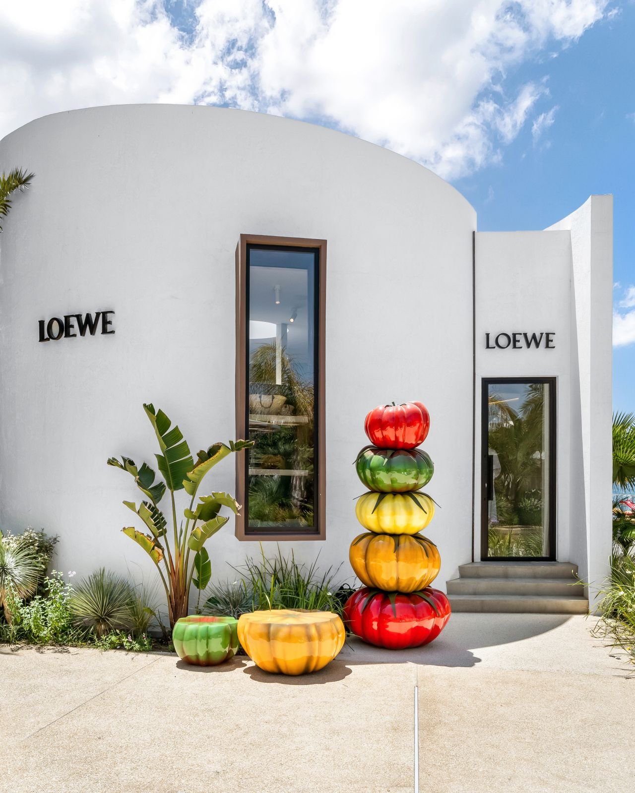 Loewe’s Juicy Summer Statement: Colorful Tomato Towers Sprout Across the Mediterranean